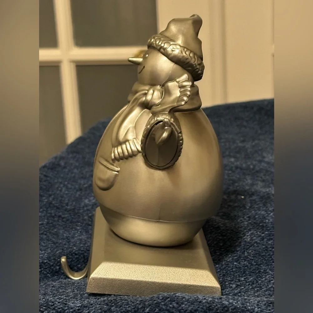 Silver snowman stocking holder. So cute!